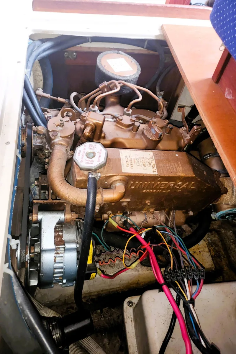 Slide: The Image of Engine compartment of a 1987 Catalina 30 Mk II sailboat, showing detailed wiring and components. - 10