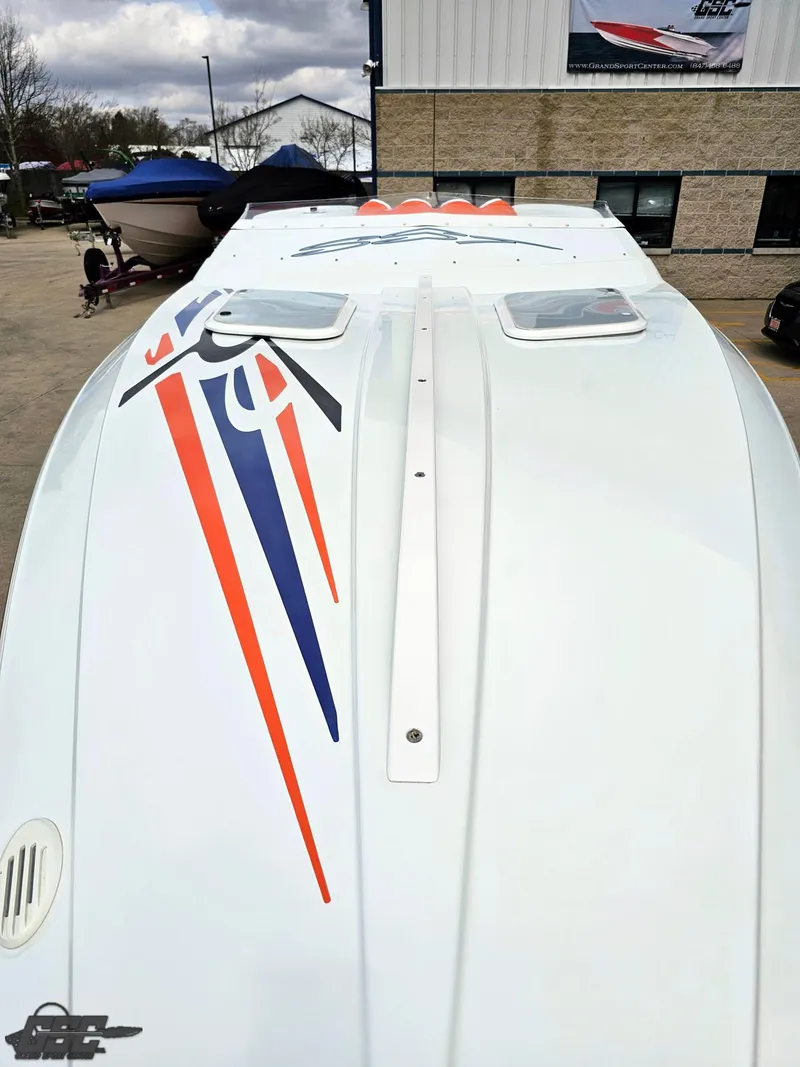 Slide: The Image of 2005 Baja 25 Outlaw boat with sleek design and vibrant graphics. - 17