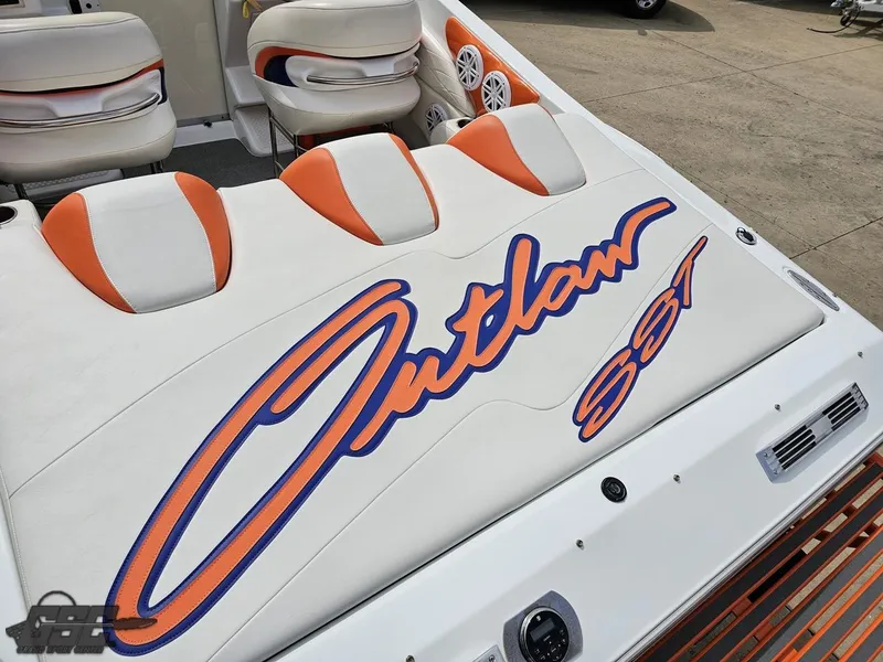 Slide: The Image of 2005 Baja 25 Outlaw boat interior with "Outlaw SST" logo in orange and blue. - 43