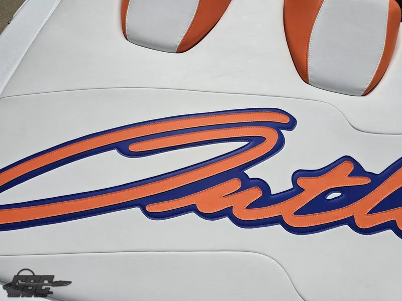 Slide: The Image of 2005 Baja 25 Outlaw boat seat with orange and blue "Outlaw" logo. - 46