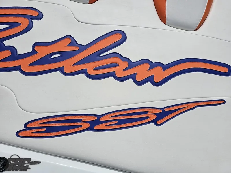 Slide: The Image of 2005 Baja 25 Outlaw boat logo with orange and blue design. - 47