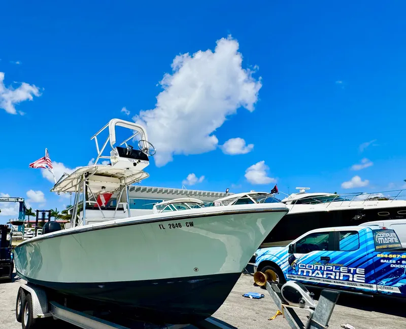 Slide: The Image of 1963 Bertram 25 Mark II sport cruiser on trailer under clear blue sky. - 1