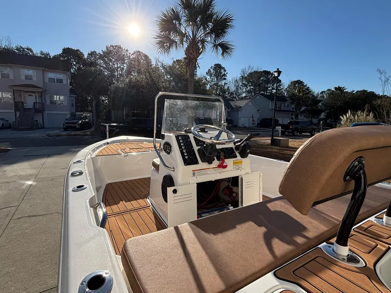 Slide: The Image of 2023 Sea Pro 172 Bay boat with console, docked under sunny skies. - 20