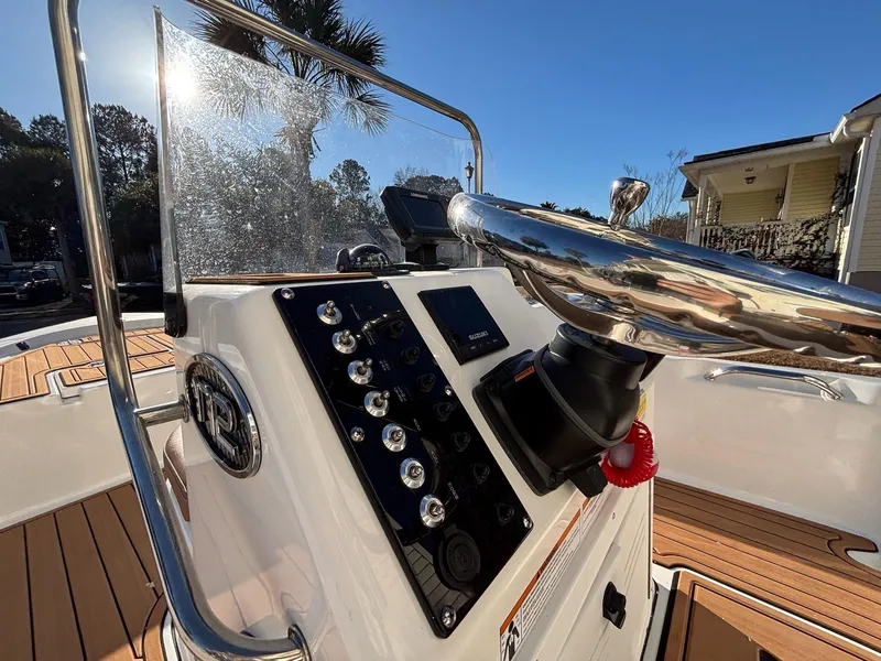 Slide: The Image of 2023 Sea Pro 172 Bay boat console with steering wheel and control panel. - 3