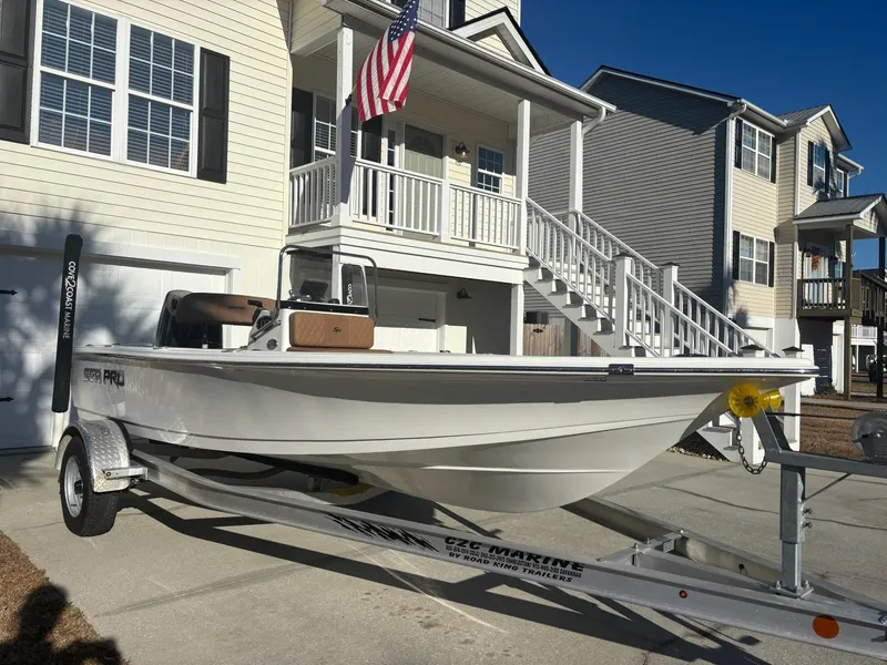 Slide: The Image of 2023 Sea Pro 172 Bay boat on trailer, parked in residential driveway. - 4