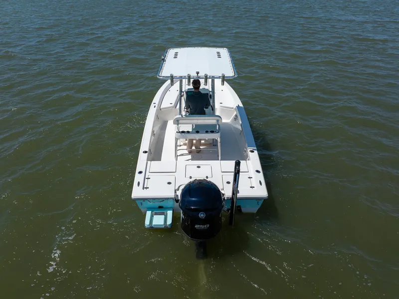 Slide: The Image of 2018 Pathfinder 2400 TRS boat on water, rear view, single outboard motor. - 11