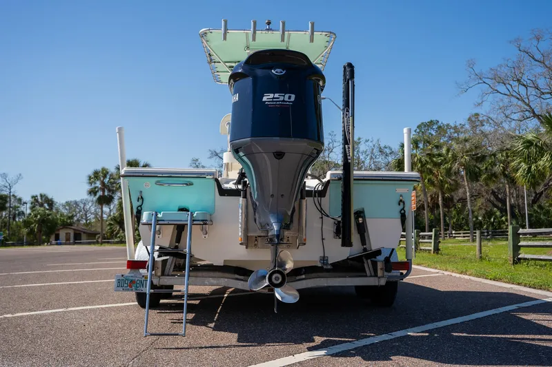 Slide: The Image of 2018 Pathfinder 2400 TRS boat with Yamaha 250 engine, parked outdoors. - 18