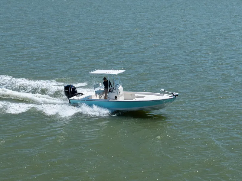Slide: The Image of 2018 Pathfinder 2400 TRS boat cruising on open water. - 2