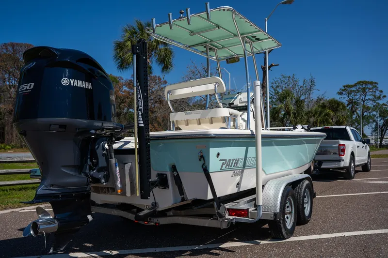 Slide: The Image of 2018 Pathfinder 2400 TRS boat on trailer with Yamaha engine, parked outdoors. - 20