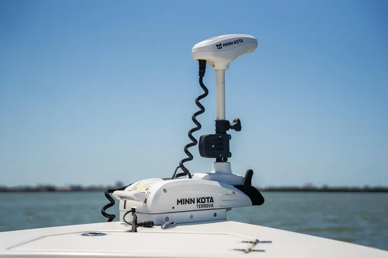 Slide: The Image of Minn Kota Terrova trolling motor on 2018 Pathfinder 2400 TRS boat, against a clear blue sky. - 26