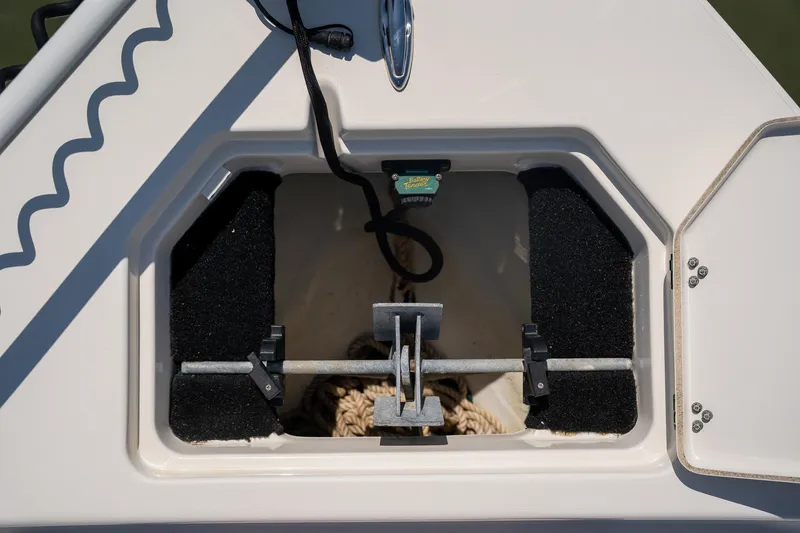 Slide: The Image of 2018 Pathfinder 2400 TRS anchor storage compartment with rope and secure fittings. - 28