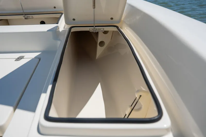 Slide: The Image of Open storage compartment on a 2018 Pathfinder 2400 TRS boat, showcasing interior space. - 31