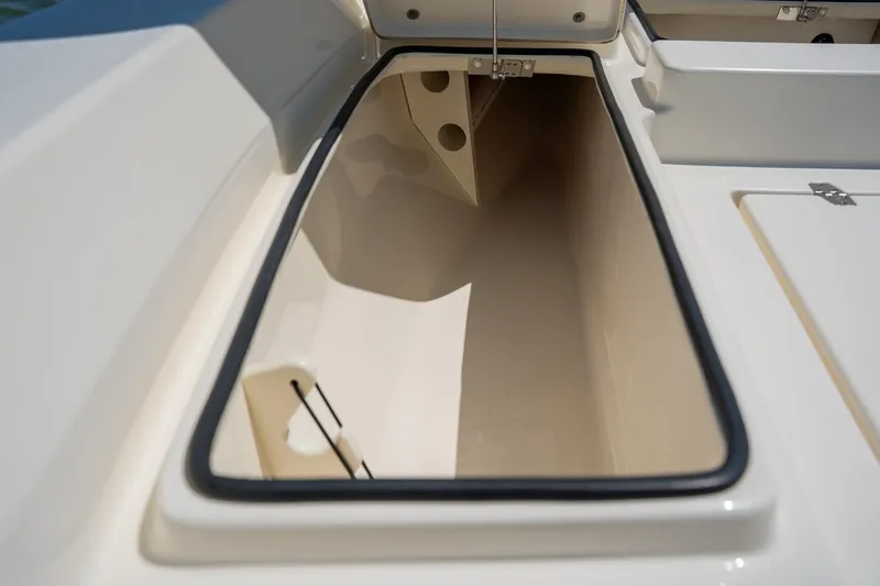 Slide: The Image of 2018 Pathfinder 2400 TRS boat storage compartment, open and empty, with clean interior. - 32