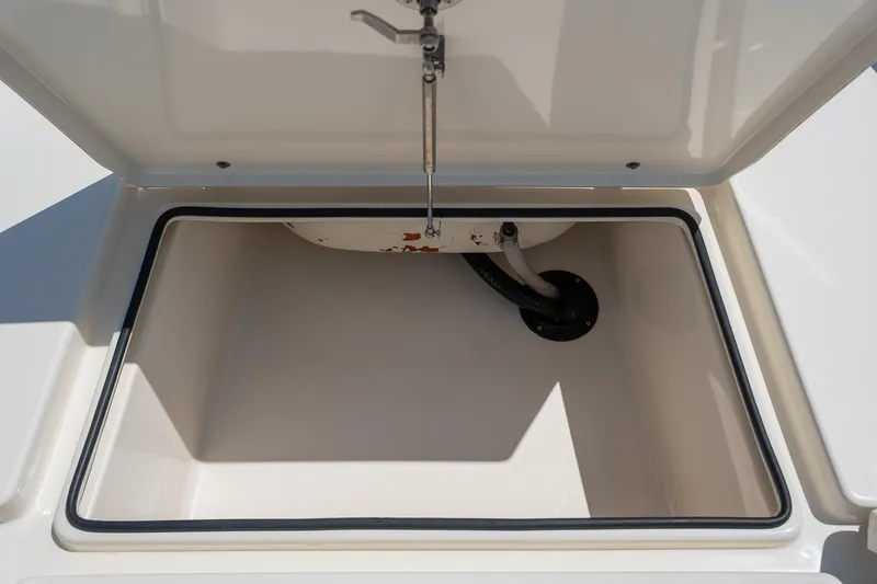 Slide: The Image of Open storage compartment on 2018 Pathfinder 2400 TRS boat, showcasing interior space. - 33