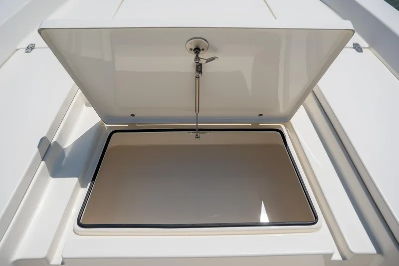 Slide: The Image of Open storage compartment on 2018 Pathfinder 2400 TRS boat. - 34