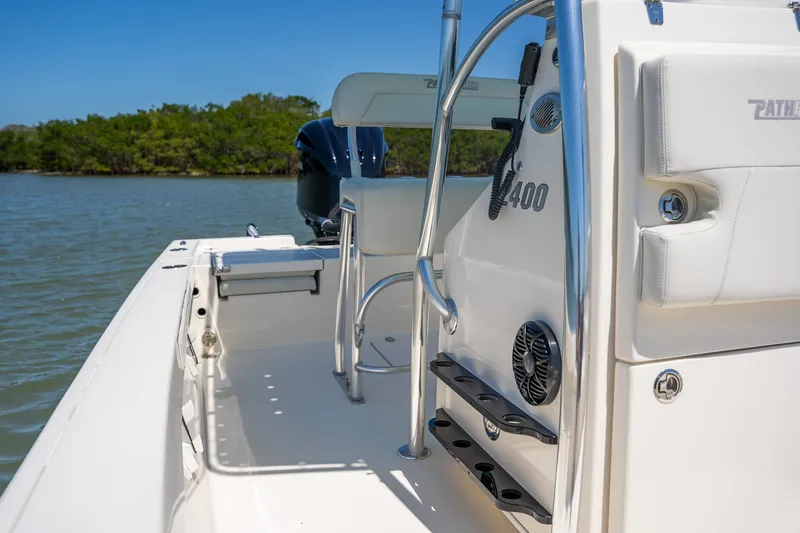 Slide: The Image of 2018 Pathfinder 2400 TRS boat interior, featuring sleek design and modern amenities on calm waters. - 37