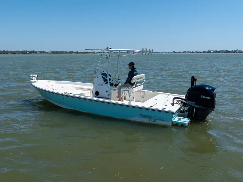Slide: The Image of 2018 Pathfinder 2400 TRS boat on water, featuring Yamaha outboard motor. - 4