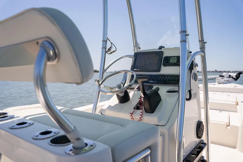Slide: The Image of 2018 Pathfinder 2400 TRS boat console with steering wheel and navigation equipment. - 45