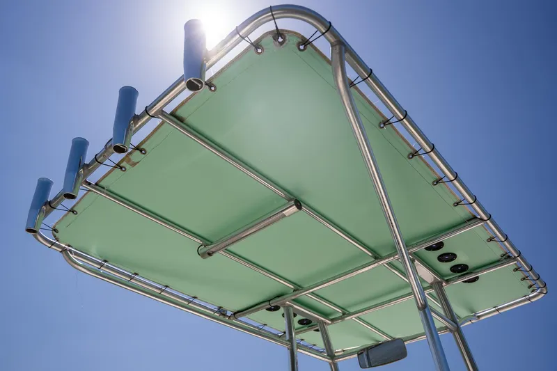 Slide: The Image of T-top of 2018 Pathfinder 2400 TRS boat under clear blue sky. - 48