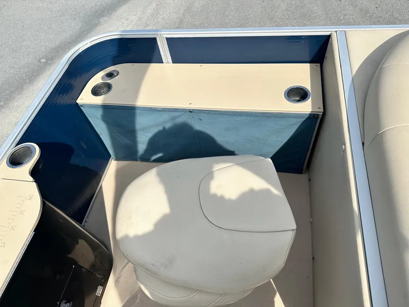 Slide: The Image of 2015 Godfrey Sweetwater 2086FCS boat interior with seating and cup holders. - 11