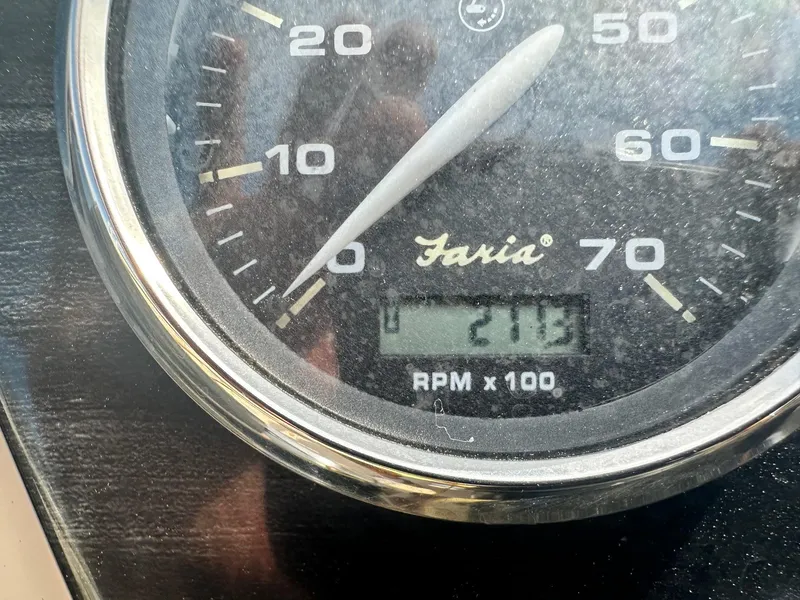 Slide: The Image of Close-up of a Faria tachometer showing 2113 RPM on a 2015 Godfrey Sweetwater 2086FCS. - 12