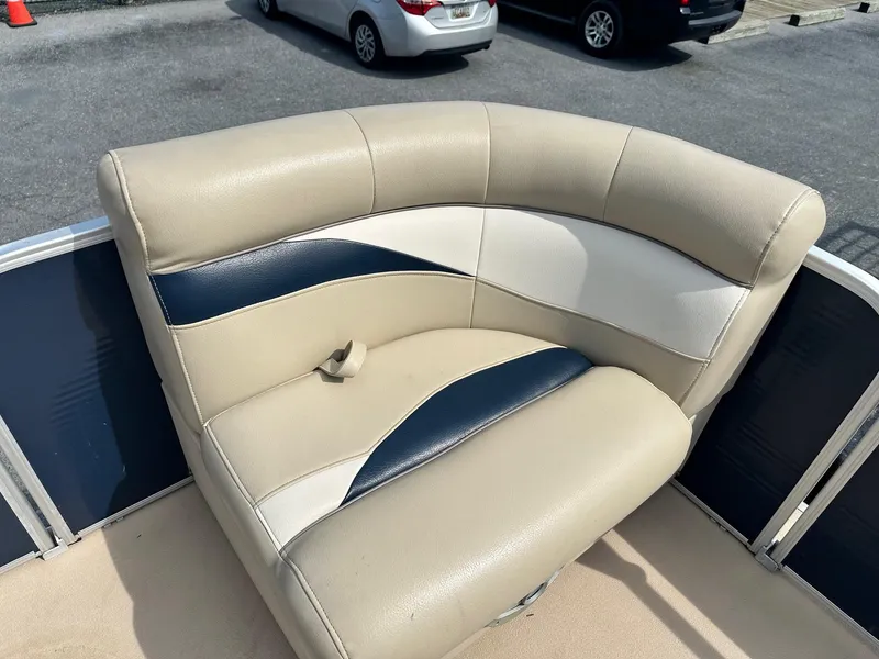 Slide: The Image of 2015 Godfrey Sweetwater 2086FCS boat seat with beige and navy upholstery. - 7