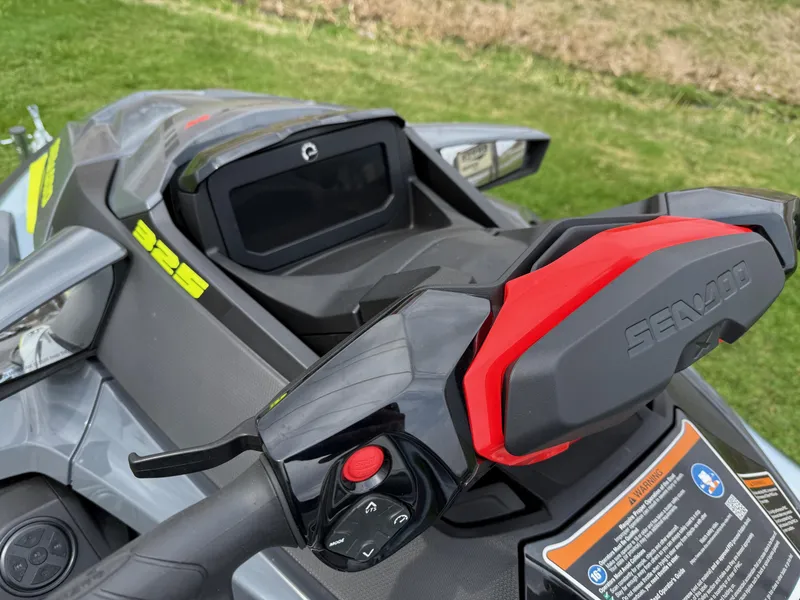 Slide: The Image of 2024 Sea-Doo RXT-X 325 Ice Metal/Manta Green jet ski handlebar and dashboard. - 3