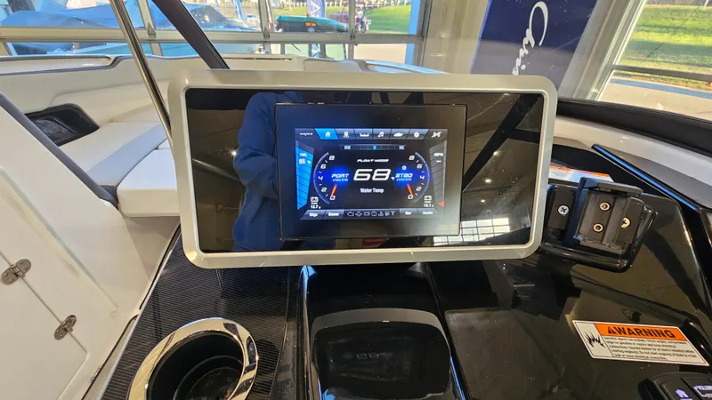 Slide: The Image of 2023 Yamaha AR250 boat dashboard with digital display showing speed and controls. - 12