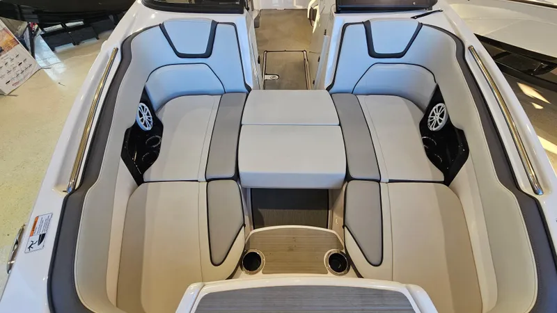 Slide: The Image of 2023 Yamaha Boats AR250 interior with spacious seating and modern design. - 17