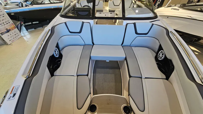 Slide: The Image of 2023 Yamaha Boats AR250 interior with spacious seating and modern design. - 18
