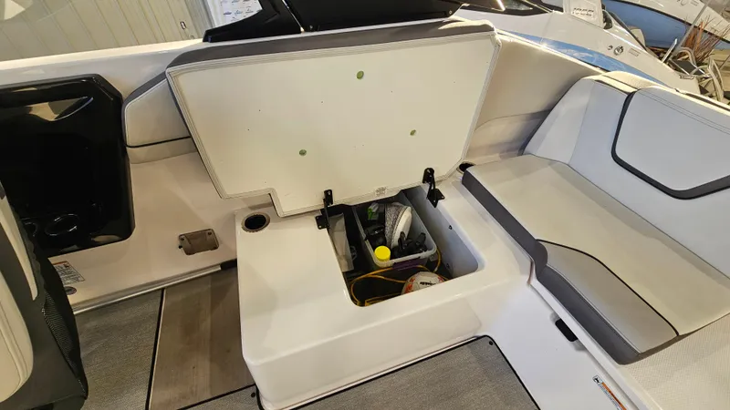 Slide: The Image of 2023 Yamaha Boats AR250 engine compartment with open hatch, showcasing interior components. - 22