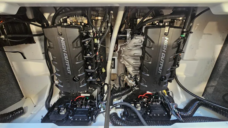 Slide: The Image of 2023 Yamaha AR250 boat engine compartment with dual engines and wiring. - 26