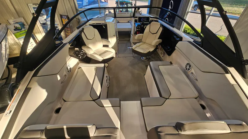 Slide: The Image of 2023 Yamaha Boats AR250 interior with spacious seating and modern design. - 4