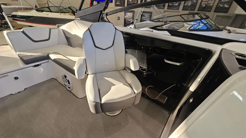 Slide: The Image of 2023 Yamaha Boats AR250 interior with modern seating and sleek design. - 8