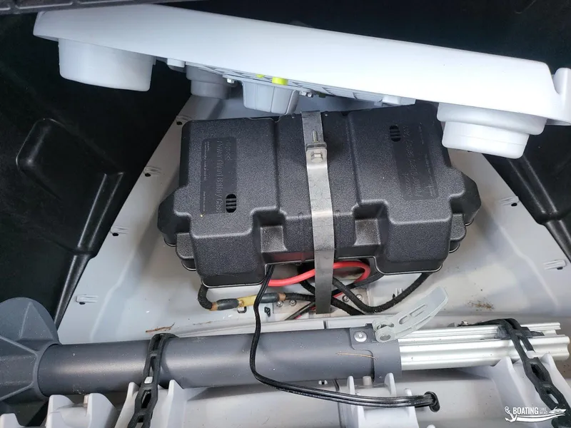 Slide: The Image of Battery compartment of 2023 Sea-Doo Switch Cruise 21, featuring secure battery housing and wiring. - 24