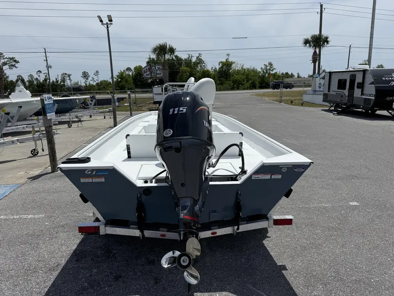 Slide: The Image of 2025 G3 Bay 20 boat with Yamaha 115 engine on trailer in parking lot. - 3