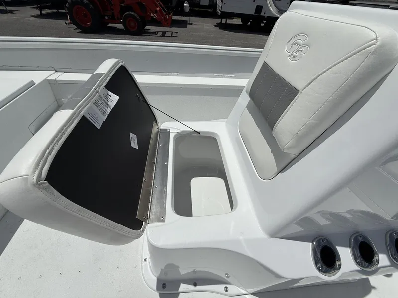 Slide: The Image of 2025 G3 Bay 20 boat seat with storage compartment and cup holders. - 6