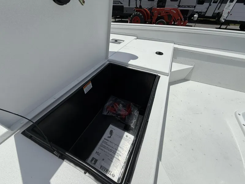 Slide: The Image of Open storage compartment on 2025 G3 Bay 20 boat deck. - 8