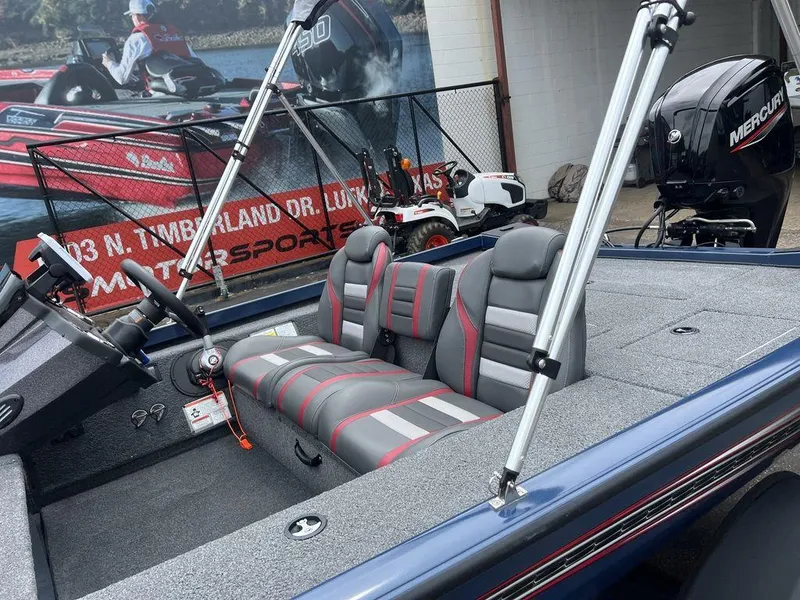 Slide: The Image of 2022 Ranger RT178C boat interior with gray and red seats, featuring a Mercury engine. - 10