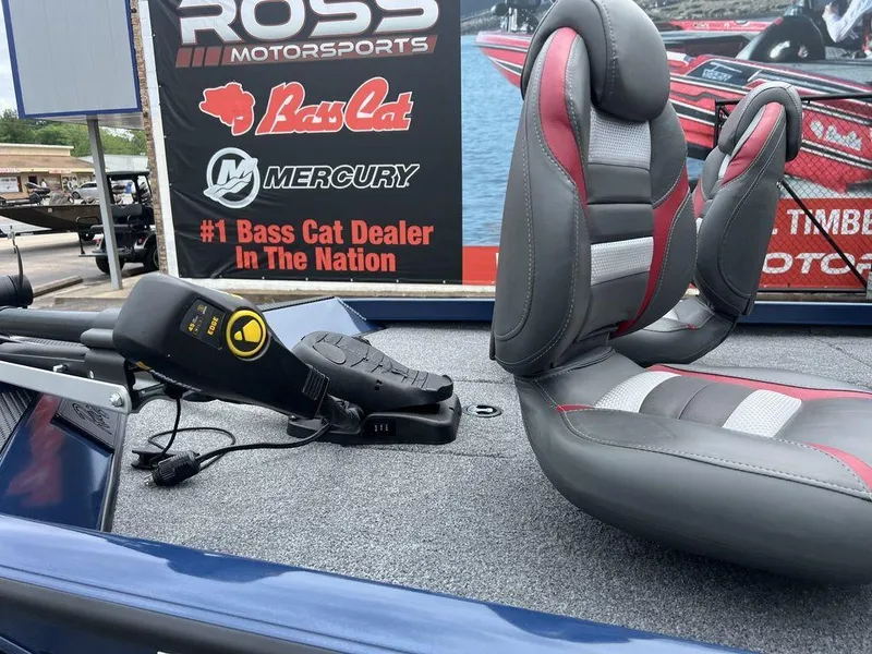 Slide: The Image of 2022 Ranger RT178C boat interior with seats and trolling motor, displayed at Ross Motorsports. - 13