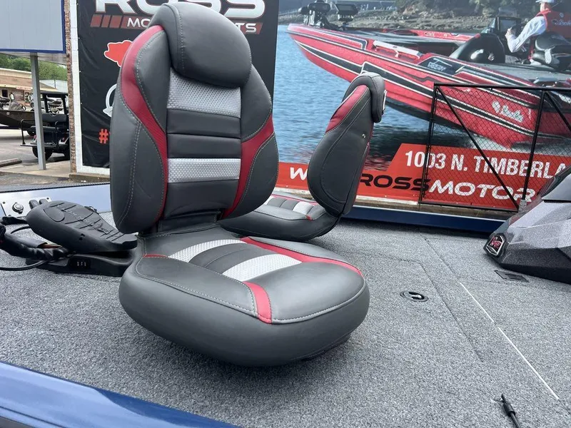 Slide: The Image of 2022 Ranger RT178C boat seat with red and gray upholstery on a carpeted deck. - 14