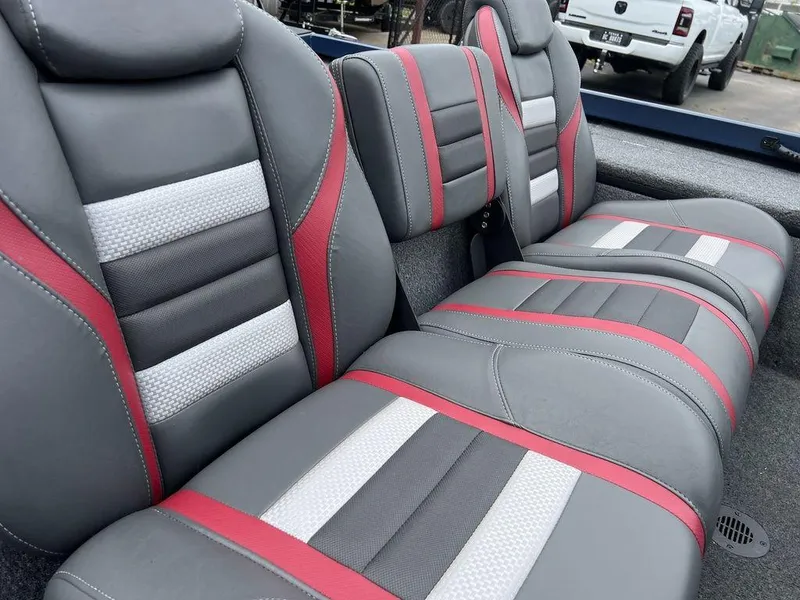 Slide: The Image of 2022 Ranger RT178C boat seats with gray, red, and white upholstery. - 29