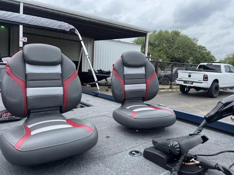 Slide: The Image of 2022 Ranger RT178C boat seats with gray and red accents, parked near a white truck. - 30