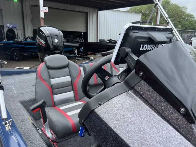 Slide: The Image of 2022 Ranger RT178C boat interior with Lowrance electronics and Mercury engine in the background. - 34