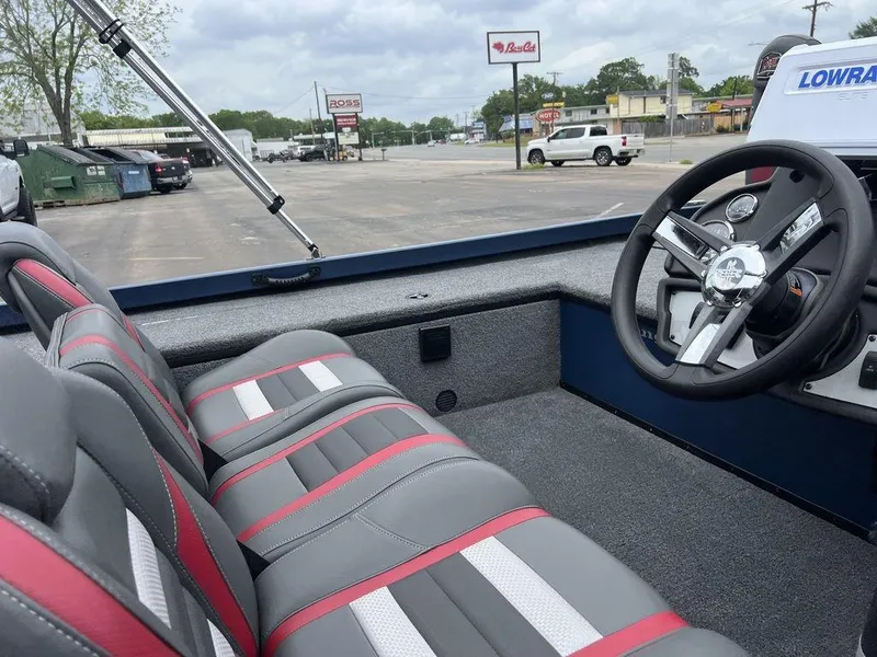 Slide: The Image of 2022 Ranger RT178C boat interior with gray and red seats, steering wheel, and Lowrance display. - 37