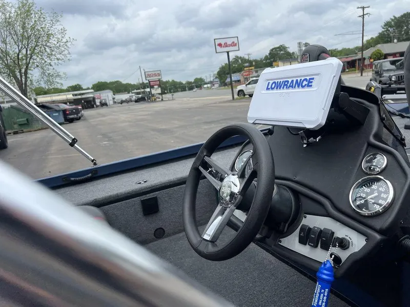 Slide: The Image of 2022 Ranger RT178C boat dashboard with Lowrance GPS, steering wheel, and gauges. - 38