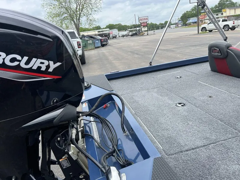 Slide: The Image of 2022 Ranger RT178C boat with Mercury engine, parked in a lot. - 39