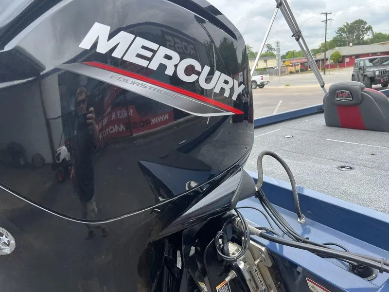 Slide: The Image of 2022 Ranger RT178C boat with Mercury FourStroke engine in a parking lot. - 44