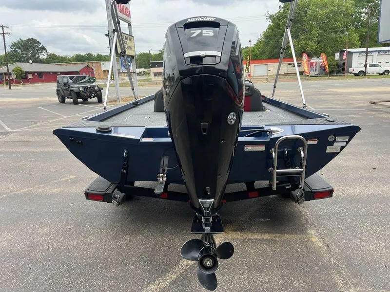 Slide: The Image of 2022 Ranger RT178C boat with Mercury 75 engine, parked outdoors. - 49