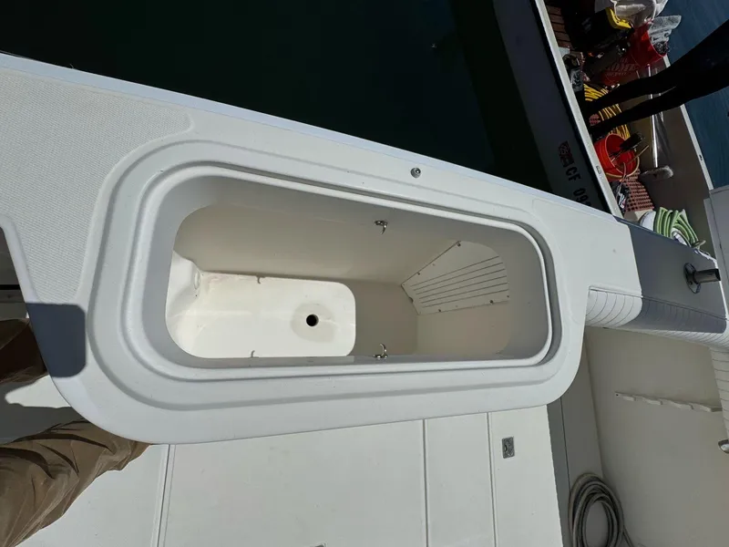 Slide: The Image of Open storage compartment on 1998 Cabo 35 Express boat deck. - 37